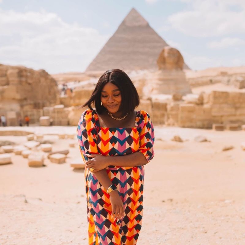 Dr. Fawziah Qadir at Giza, with Khafre's pyramid and the Sphinx behind her
